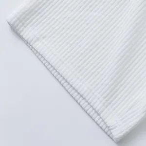 Macro detail of high-quality white heavy jacquard ribbed fabric on men's casual shorts