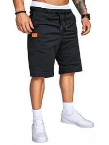 Pantaloncini sportivi neri da uomo vestibilità comoda con dettaglio patch arancione vivace