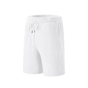 Close-up of white men's sports shorts showing vertical ribbed jacquard texture and waistband