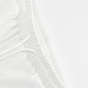 Close-up of white ribbed fabric detail on men's drawstring casual shorts