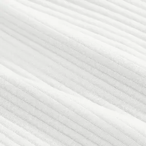 High-resolution macro detail of white heavy jacquard ribbed fabric for men's casual beach shorts