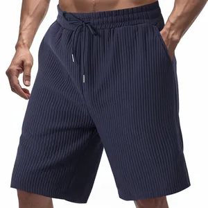 Detail view of navy blue textured jacquard men's casual sports shorts with drawstring waist.