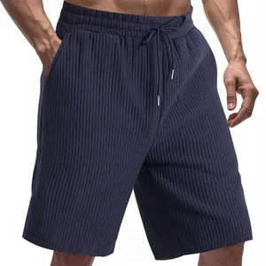 Close-up of men's navy blue heavy jacquard beach shorts with elastic waist and drawstring detail