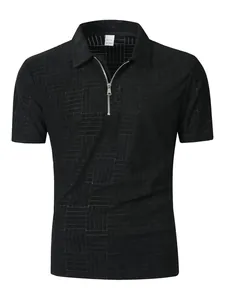 Detail view of a men's black zip polo shirt featuring a geometric textured pattern