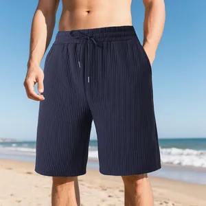 Close-up of men's navy blue ribbed jacquard beach shorts with adjustable drawstring waist.