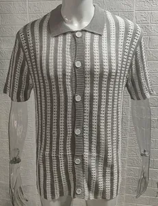 Detail view of the vertical stripe texture and button closure on this knitted polo shirt