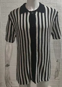 Close-up of vertical black and white striped knitted polo cardigan with buttons