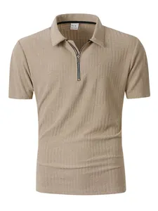 Detail view of the textured geometric pattern on a khaki men's quarter-zip polo shirt