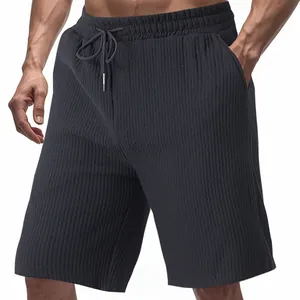 Close-up of men's dark grey jacquard casual shorts with drawstring waist