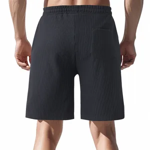 Back view of men's black textured jacquard casual shorts with an elastic waistband