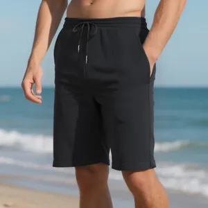 Detailed view of men's black ribbed texture casual beach shorts for summer wear