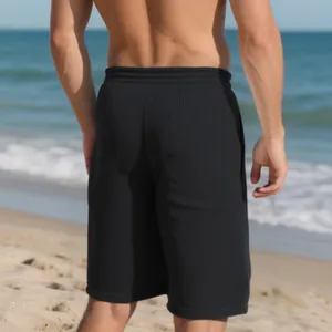 Detailed rear view of men's heavy black jacquard beach shorts with vertical textured lines