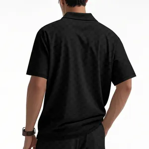 Back view detail of men's heavy black checkered jacquard polo shirt in a relaxed fit