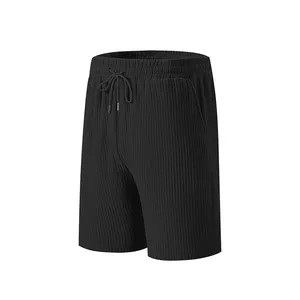 Close-up of men's black ribbed drawstring shorts showing fine vertical texture