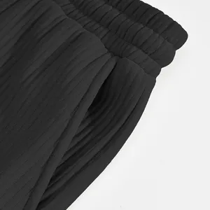Macro detail of textured jacquard fabric and side pocket on black men's casual shorts