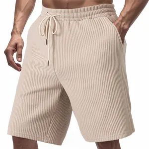 Detail view of men's summer casual shorts featuring heavy jacquard texture and beige color