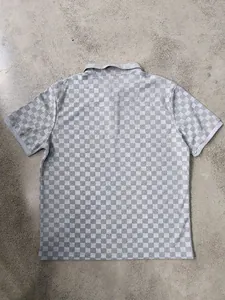 Detailed back view of men's casual gray checkerboard jacquard half-zip polo shirt