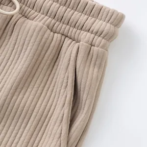 Close-up view showing the heavy jacquard ribbed fabric and pocket of these beige men shorts
