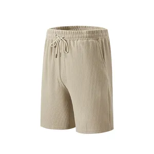 Close-up detail showing vertical ribbed texture of men's beige casual shorts