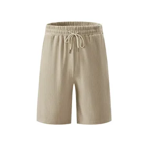 Detail view of men's beige heavyweight ribbed jacquard shorts with drawstring waist.