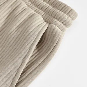 Detail of men's ribbed jacquard shorts featuring elastic waistband and side pocket