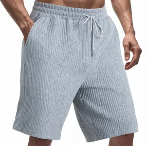 Detail view of men's grey heavyweight jacquard casual shorts featuring a drawstring waist