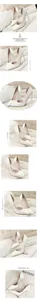 Detailed view of elegant white patent leather pointed-toe stilettos.