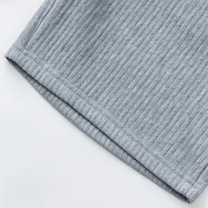 High-quality close-up of grey ribbed knit fabric and hem stitching on men's shorts