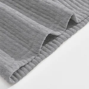 Close-up of grey jacquard fabric texture on men's heavy-duty casual beach shorts