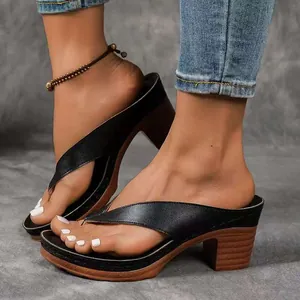 Elegant black chunky high heel thong sandals for women featuring wooden texture soles