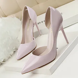Elegant pale pink patent leather d'Orsay stilettos with pointed toe and thin heels