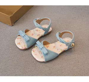 Sweet light blue girls' sandals with floral insole and bow detail for summer beach