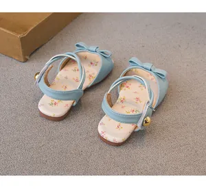 Detailed view of blue toddler girl sandals featuring sweet floral insole and bow decoration
