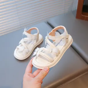 Élégantes sandales blanches pour filles avec nœuds papillon en strass et semelles souples