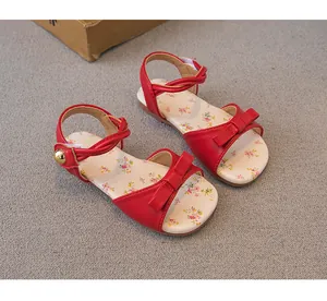 Red sweet style girls' sandals featuring floral print insole and decorative bow detail view