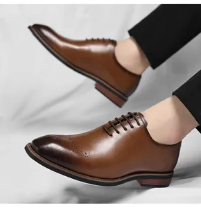 Close-up of classic brown leather men's Oxford shoes with elegant brogue toe details.