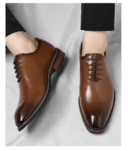 Close-up of brown leather Oxford shoes featuring brogue details and square toe design