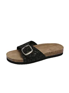 Close-up of women's platform slide sandal featuring black leopard print and metallic buckle