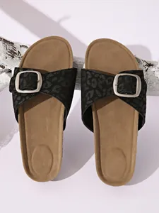Detail of leopard print slide sandals with metallic buckle and ergonomic footbed