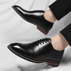 Classic men's black leather Oxford dress shoes for formal business wear and suits