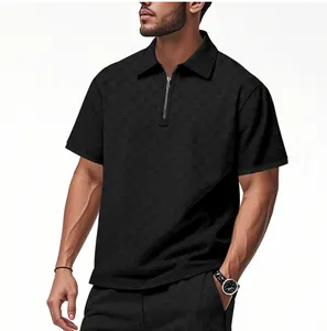 Detail view of men's black polo shirt featuring checkered jacquard pattern and half-zip