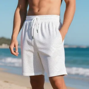 Detail of men's summer shorts featuring heavy jacquard texture and drawstring waist.
