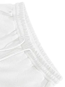 Close-up detail of white heavy-duty jacquard textured fabric on men's high street shorts