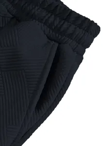 Macro detail of navy heavyweight jacquard textured fabric on high street shorts
