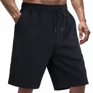 Close-up of men's loose heavy jacquard shorts with unique geometric textured pattern detail