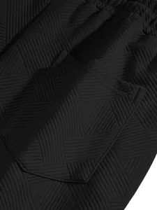 Close-up detail of black men's shorts featuring heavyweight jacquard texture and pocket