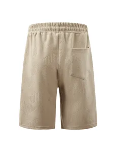 Back view of men's beige shorts with a textured jacquard pattern and single rear pocket.