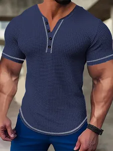 Detail view of men's navy slim-fit seersucker Henley shirt with waffle texture