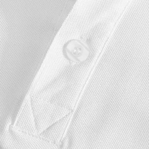 Detailed view of breathable white pique fabric and button on a premium men's Polo shirt.