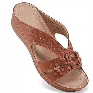 Brown wedge sandal for women featuring hollow-out design and floral decorations